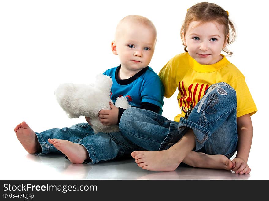 Brother And Sister Sitting Smiling