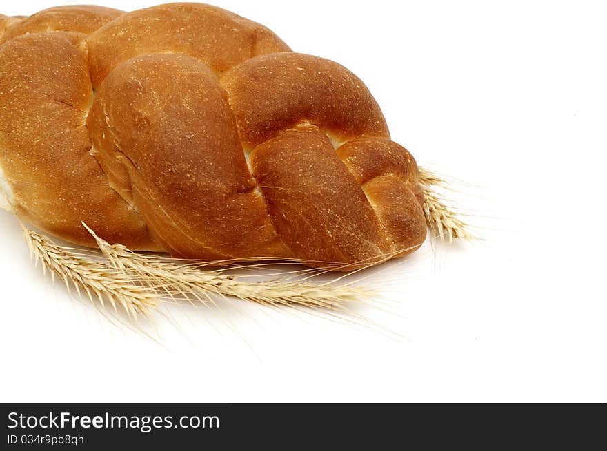 A pigtail on white bread isolated on white background