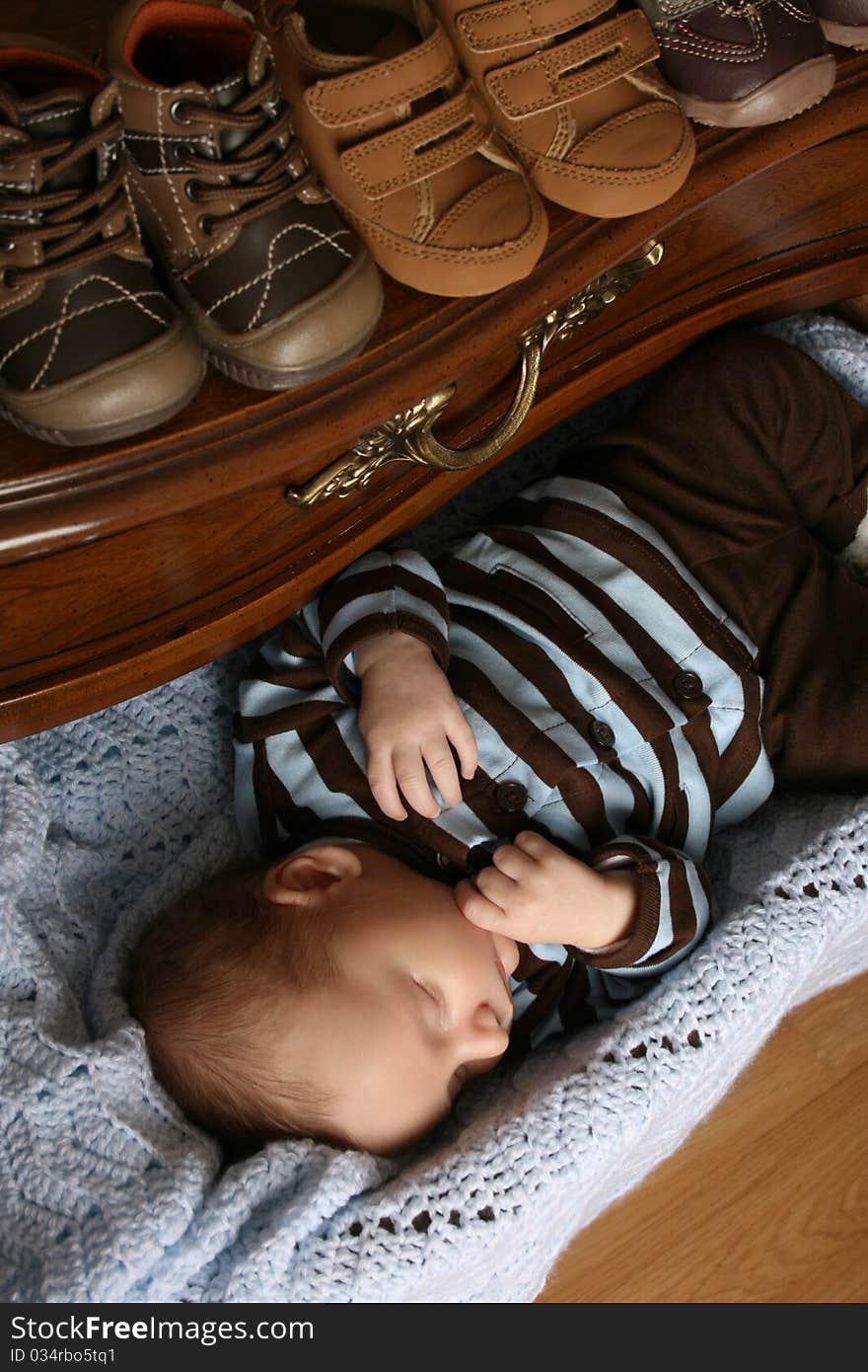 One month old baby boy sleeping in a drawer. One month old baby boy sleeping in a drawer