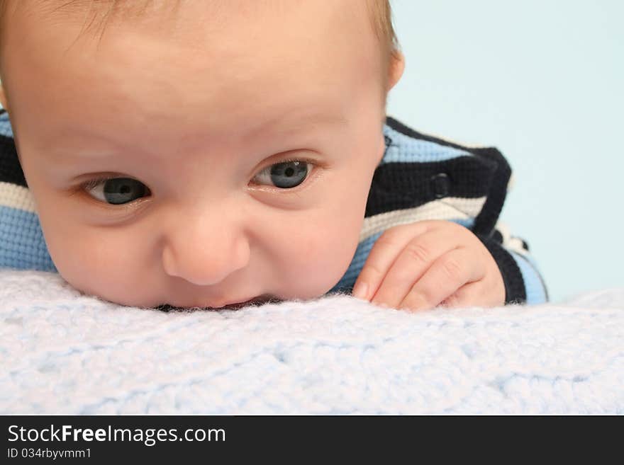 Two month old baby boy lying on his stomach