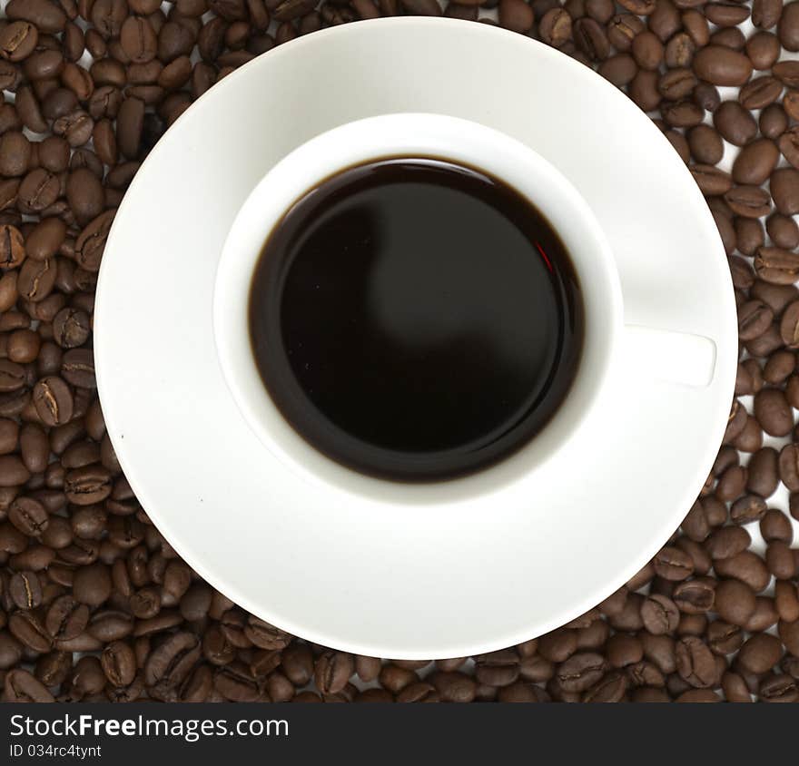 Aroma coffee cup on coffee beans background. Aroma coffee cup on coffee beans background