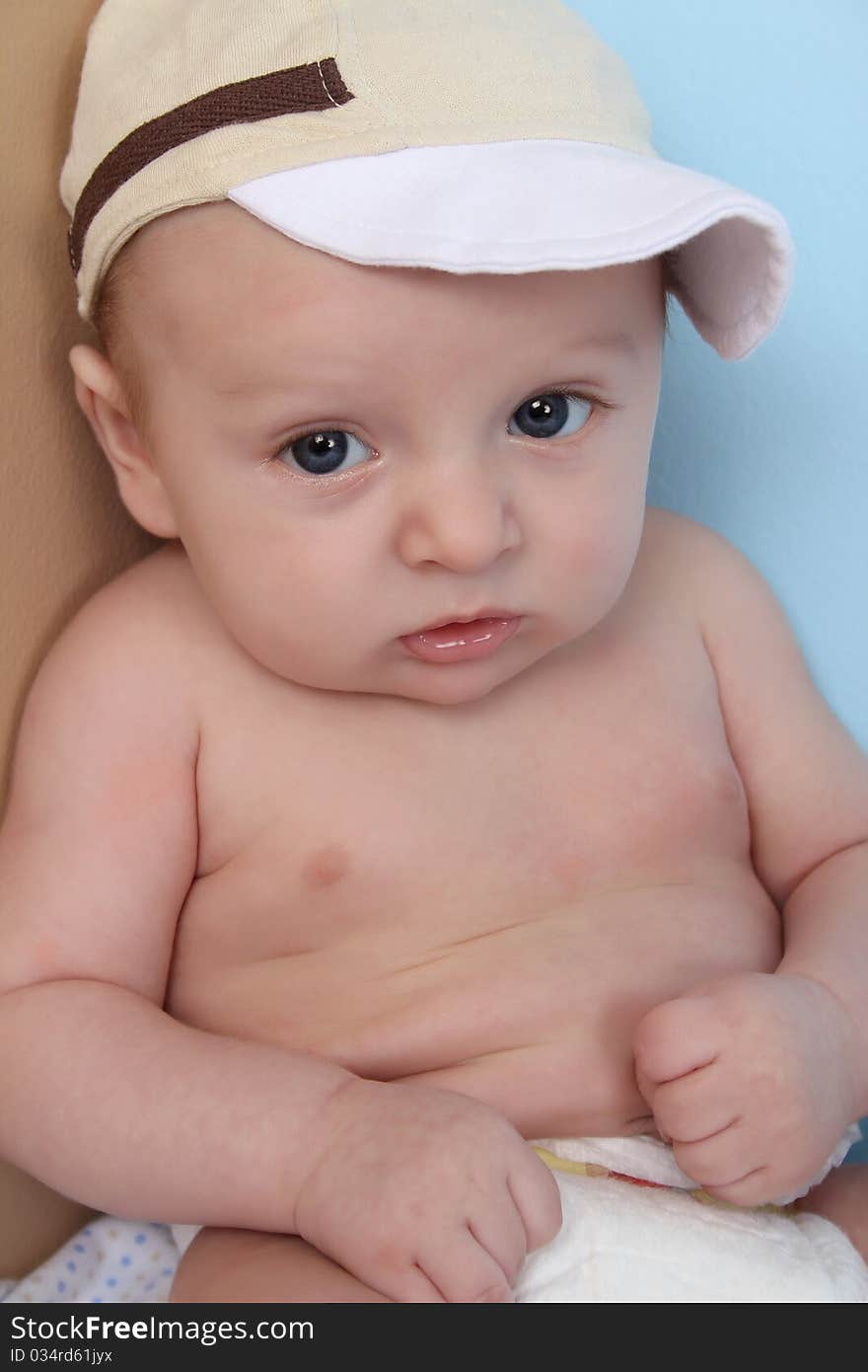 Ten week old baby boy wearing a hat