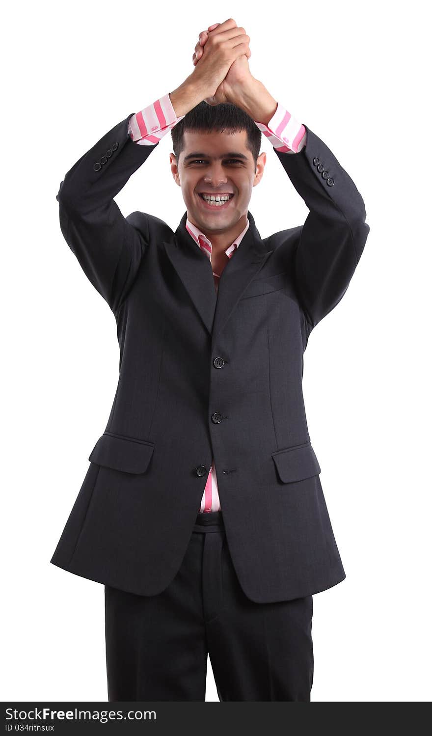 Winning young man in a business suit on white background.