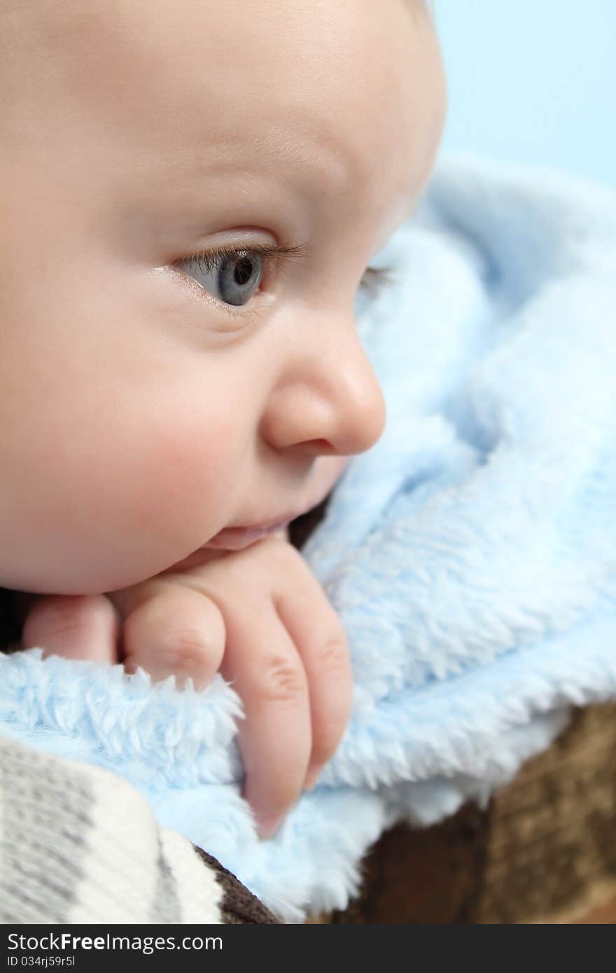 Beautiful baby boy staring into the distance. Beautiful baby boy staring into the distance