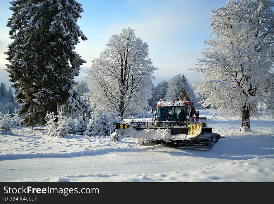 Ski machine (snow cat) grooming cross-country piste before competition. Ski machine (snow cat) grooming cross-country piste before competition