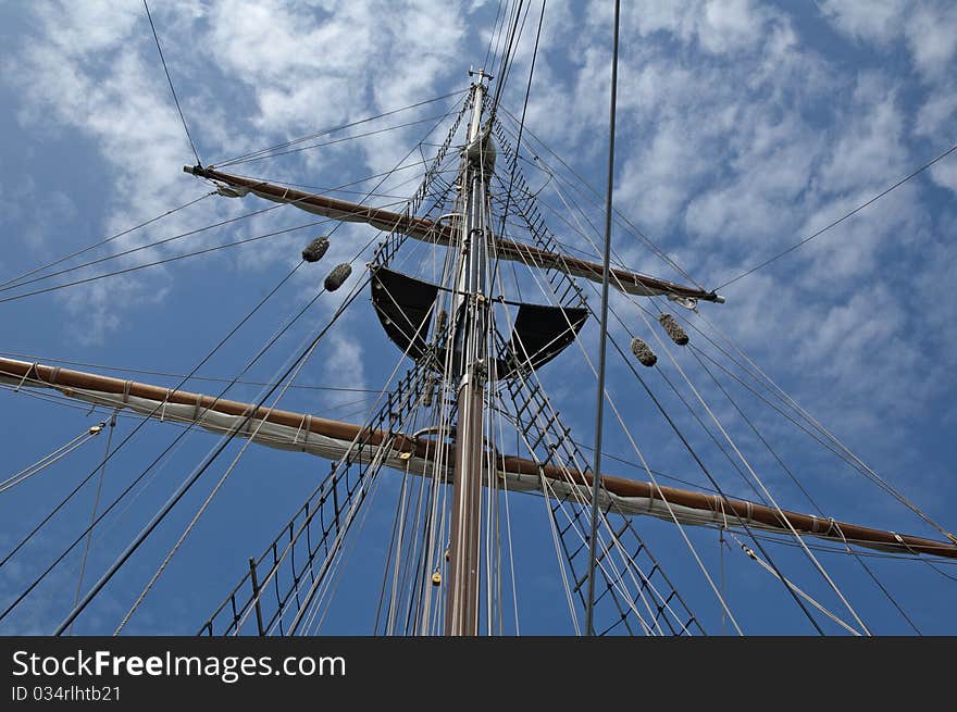 This mast was reaching for the beautiful cloudy sky. This mast was reaching for the beautiful cloudy sky.