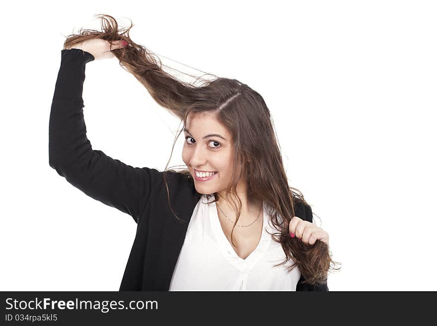 A beautiful woman pulling her long hair. A beautiful woman pulling her long hair