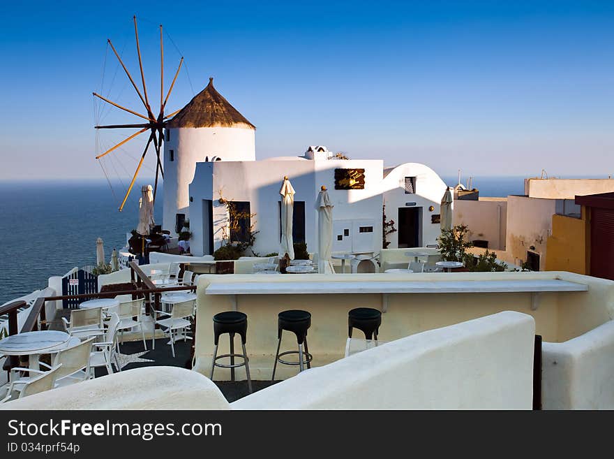 The hotel view with windmill on Santorini. The hotel view with windmill on Santorini