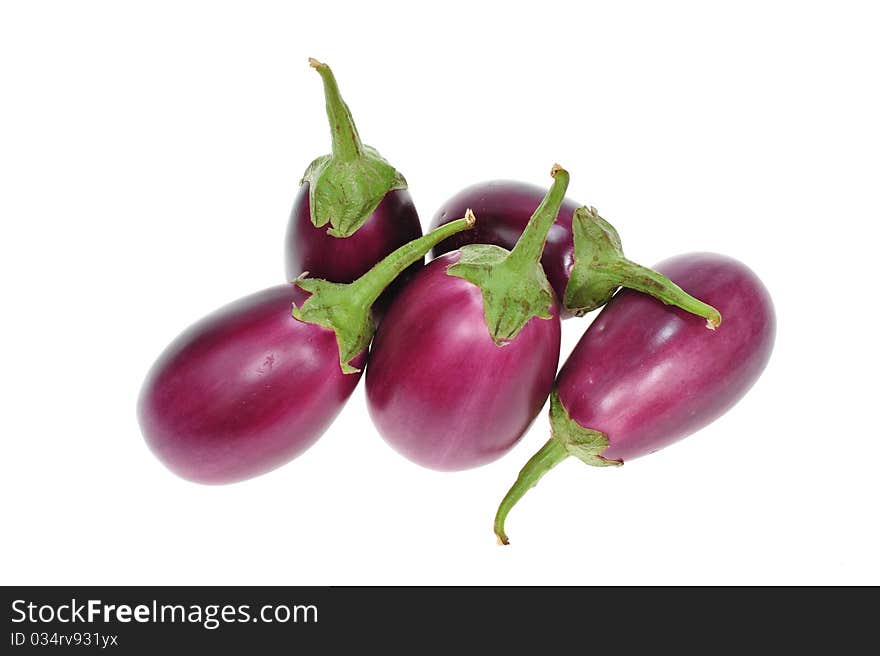 Purple Eggplants Arranged On A White Background