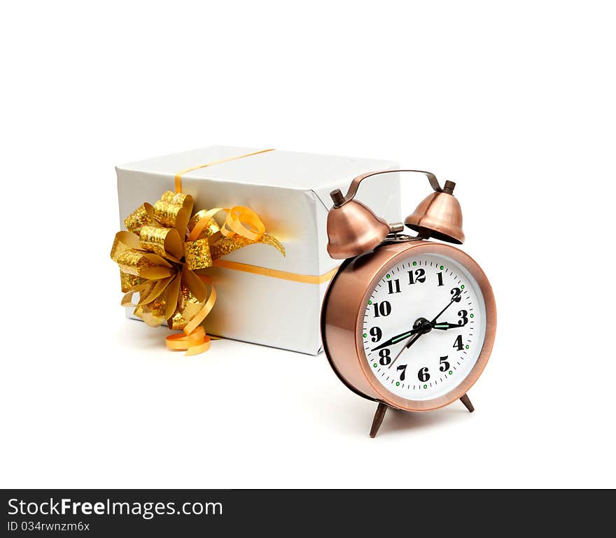 A retro clock with presents isolated on white bacground