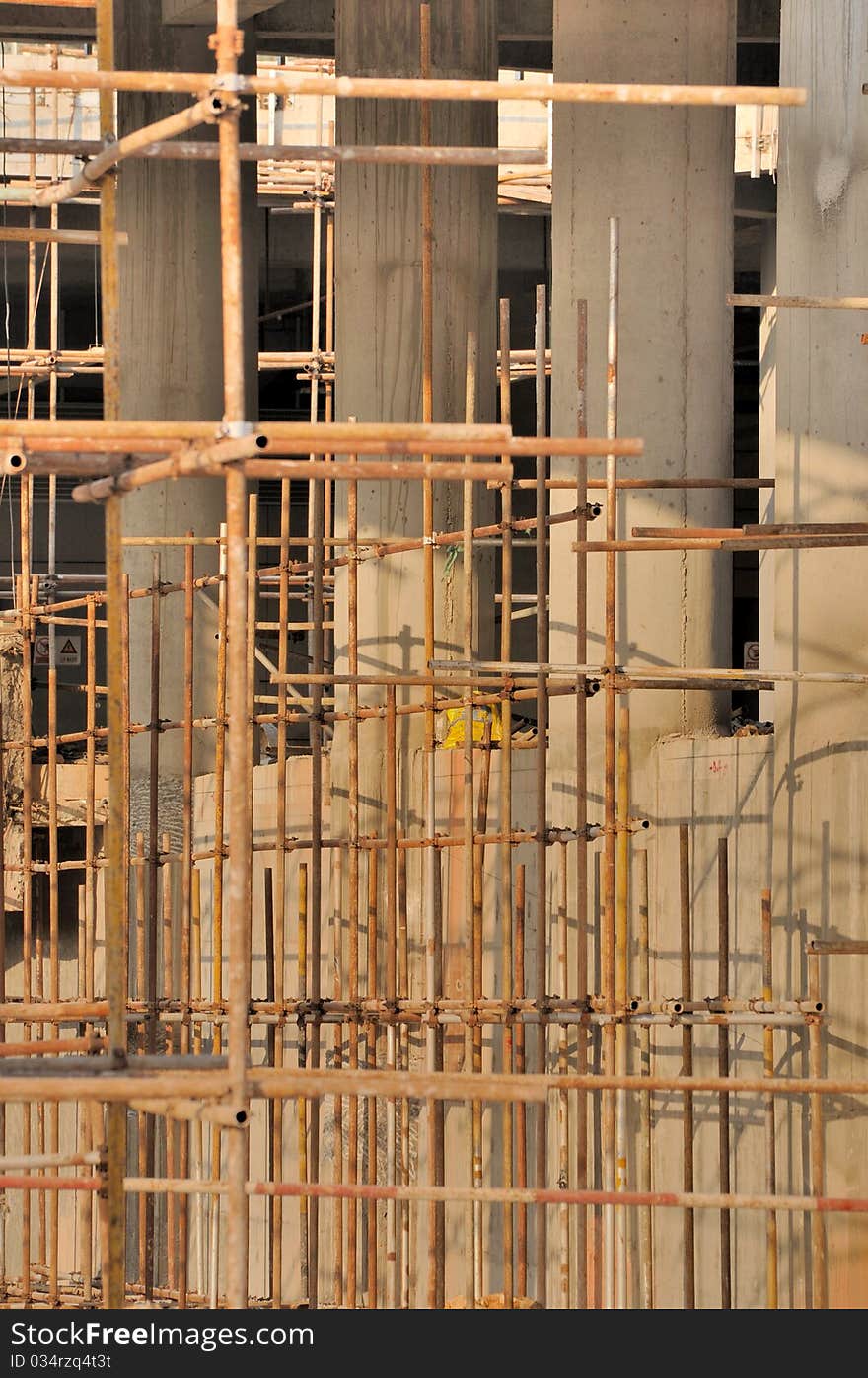 Scaffold and unfinshed poles in big construction working area. Scaffold and unfinshed poles in big construction working area.