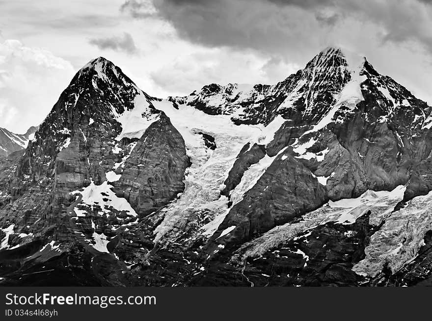 The Eiger and the Monch peaks Bernese Alps Switzerland. The Eiger and the Monch peaks Bernese Alps Switzerland