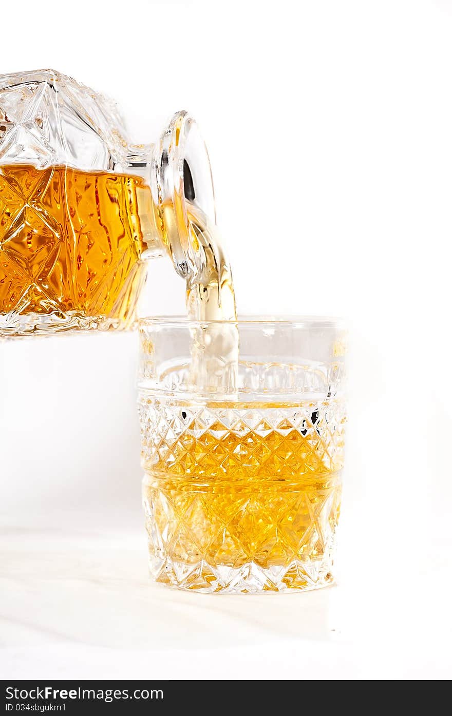 Frozen bottle of whisky with on white background