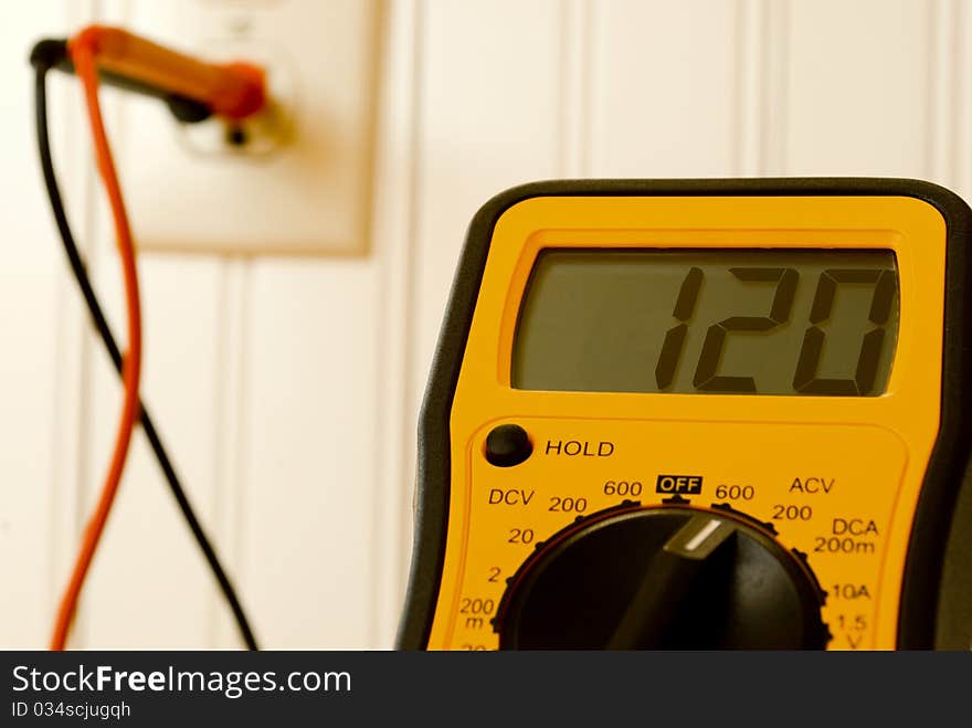 Volt meter reading voltage of wall outlet. Volt meter reading voltage of wall outlet.