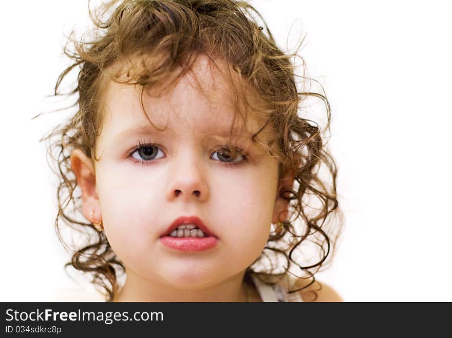 Little curly-haired girl, white background, portrait