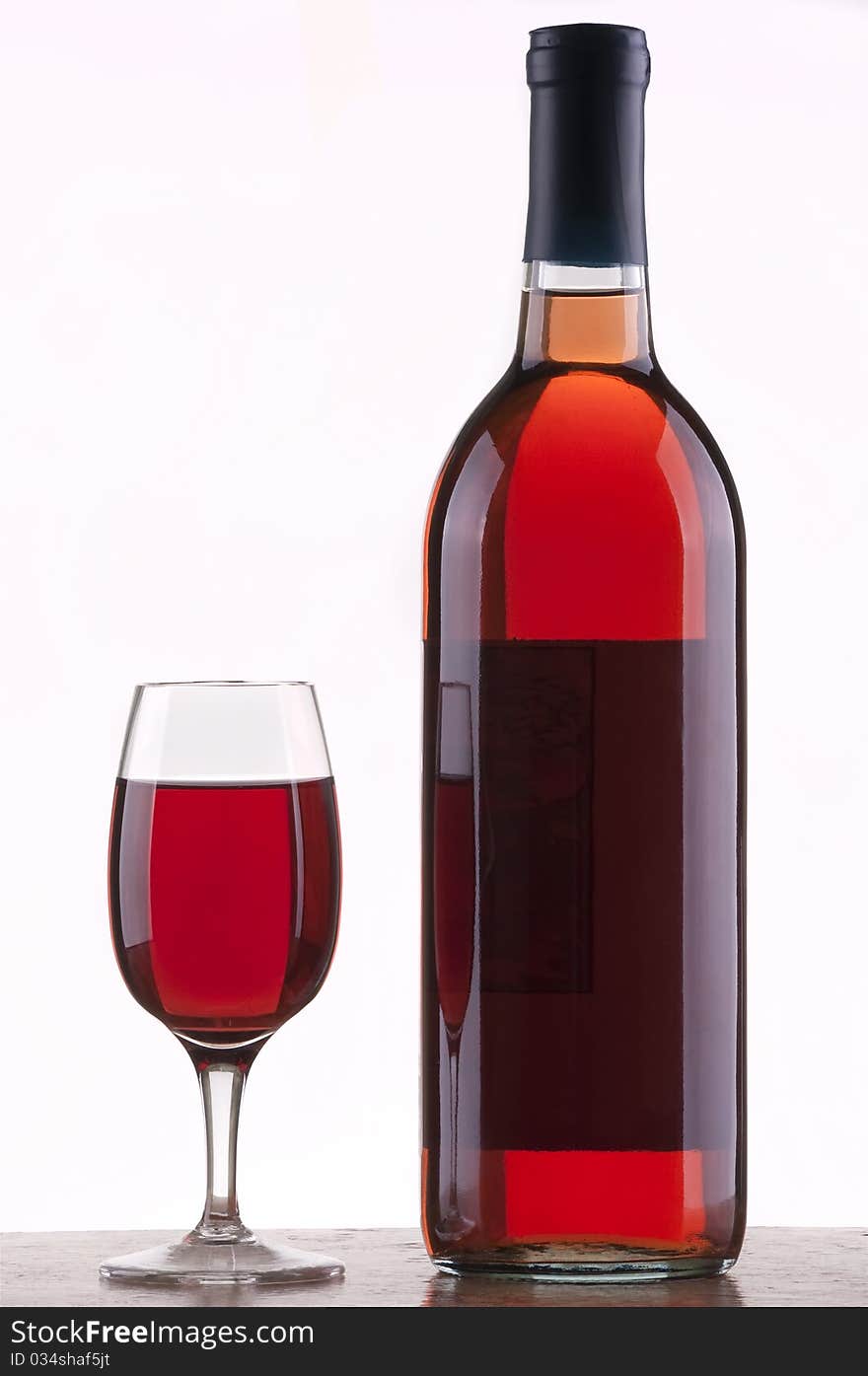 Glass and bottle of rose wine