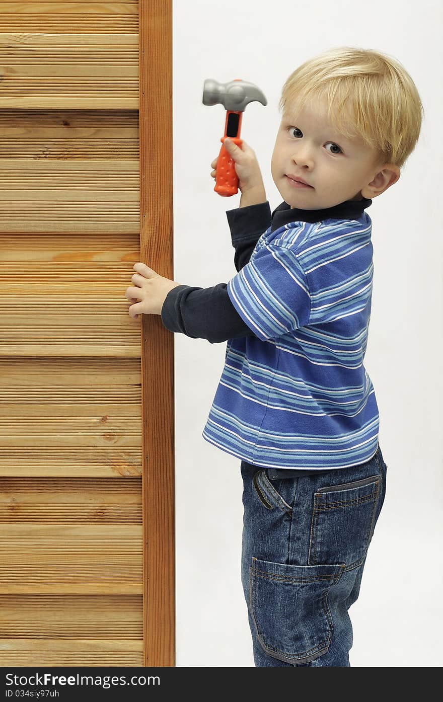 A small boy with mallet