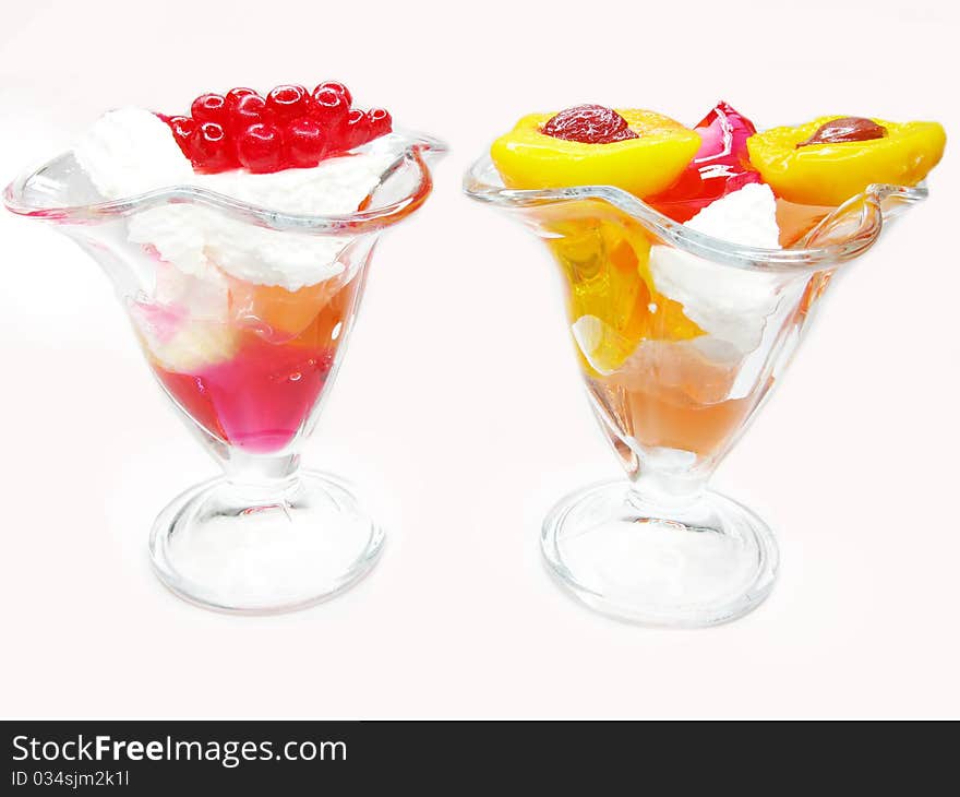 Two Desserts With Pudding And Jelly Fruits