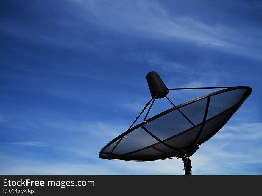 Satellite dish in blue sky