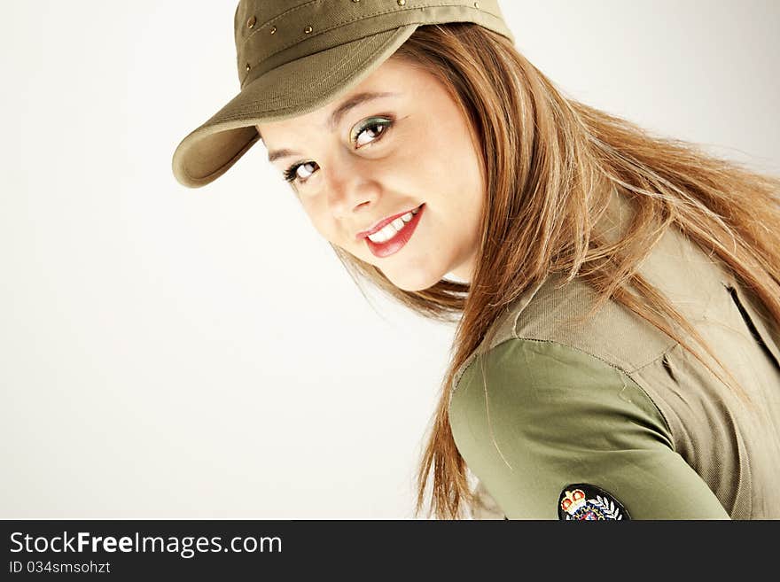 Beautiful woman in military urban clothes smiling. Beautiful woman in military urban clothes smiling