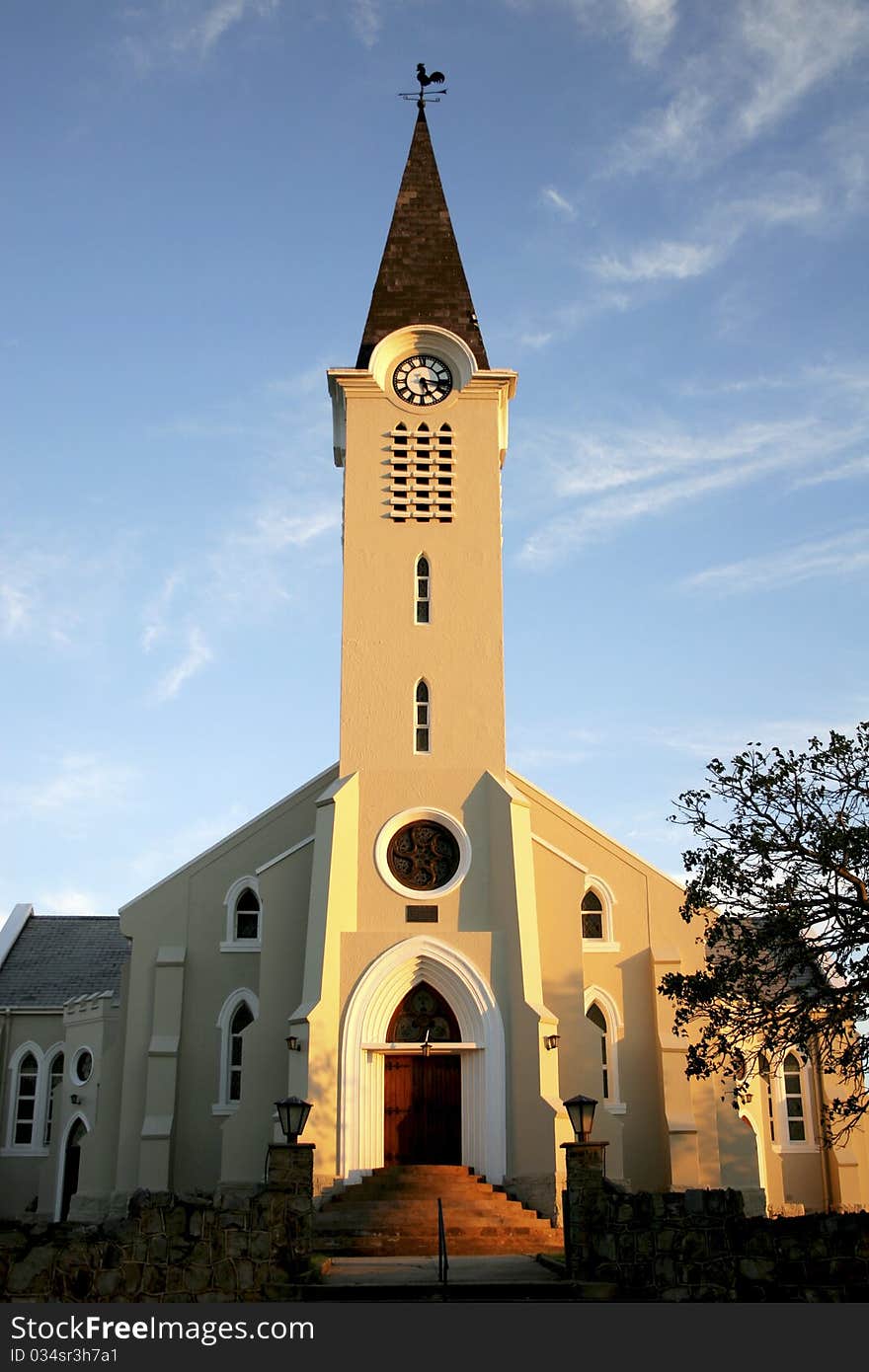 Church with tower against blue sky