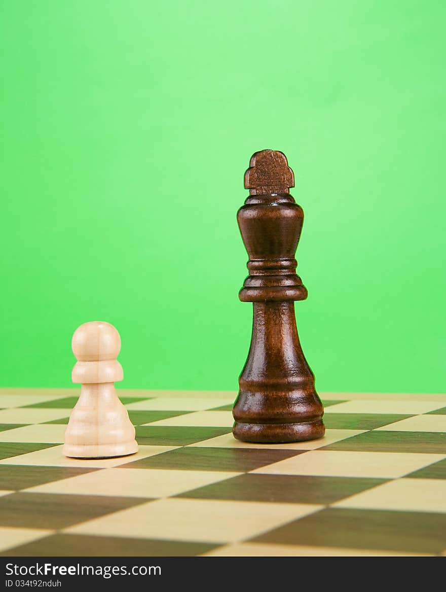 Black piece on board isolated on green background