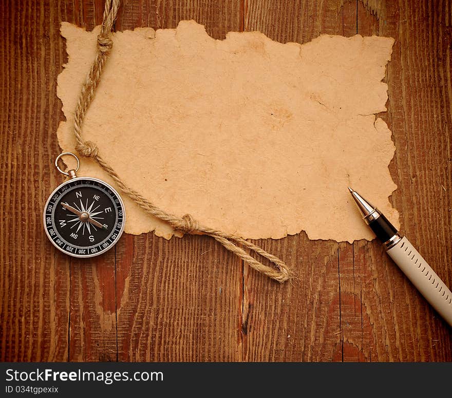 Compass, pen and rope on grunge background. Compass, pen and rope on grunge background