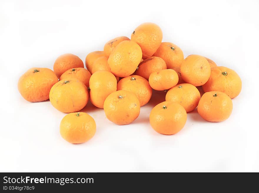 One pile of oranges on a white background.