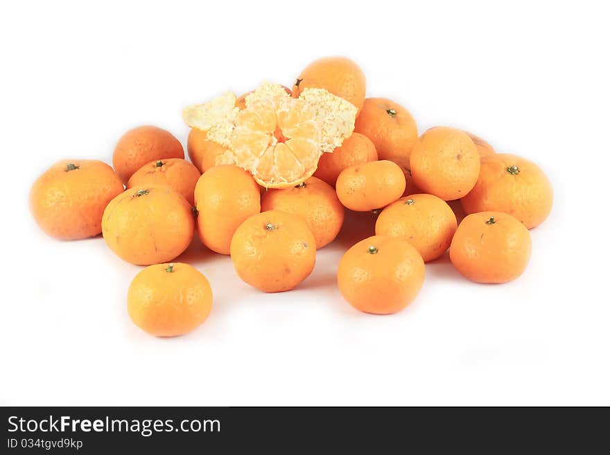 One pile of oranges on a white background.