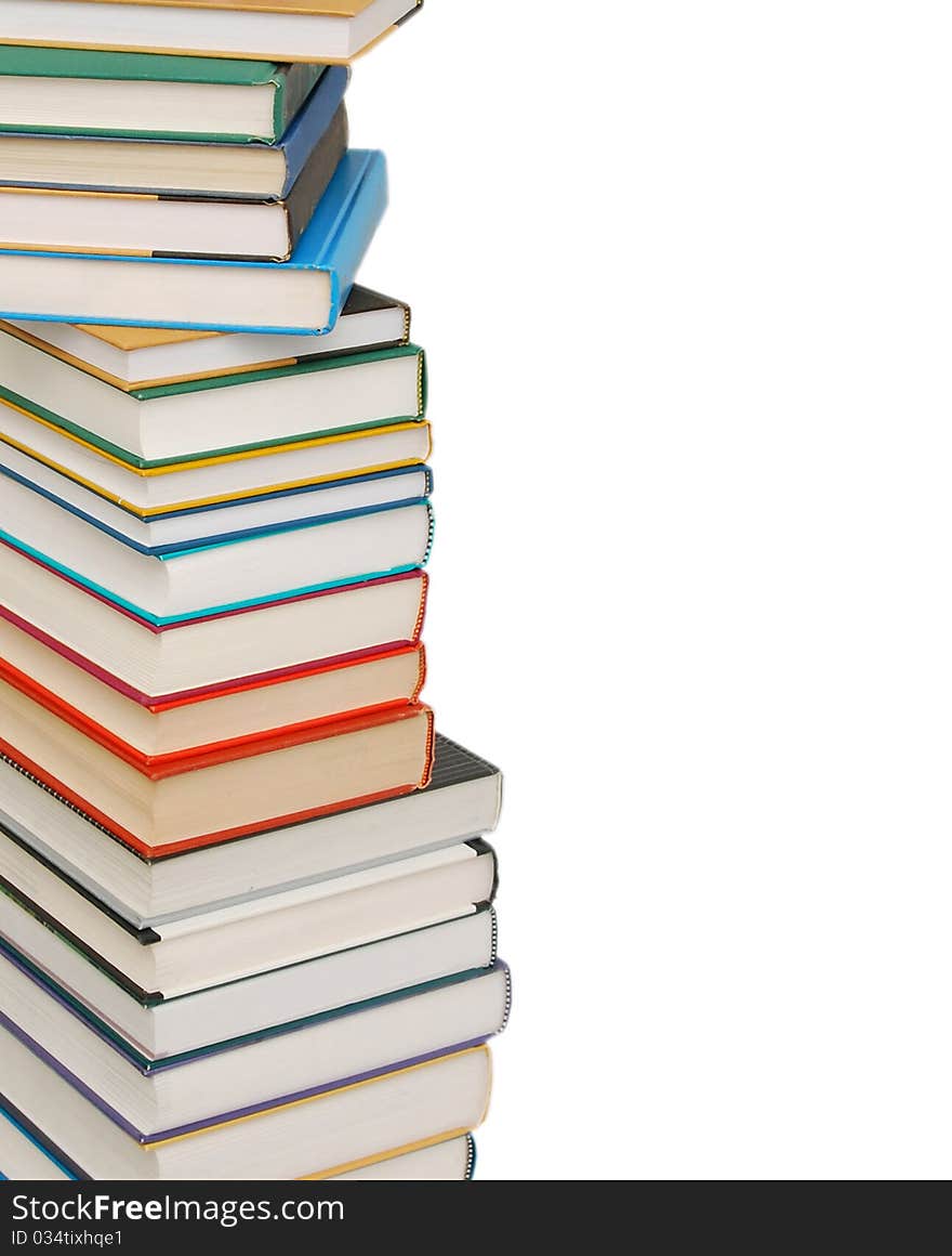 Stack of colorful real books on white background, partial view. Stack of colorful real books on white background, partial view.