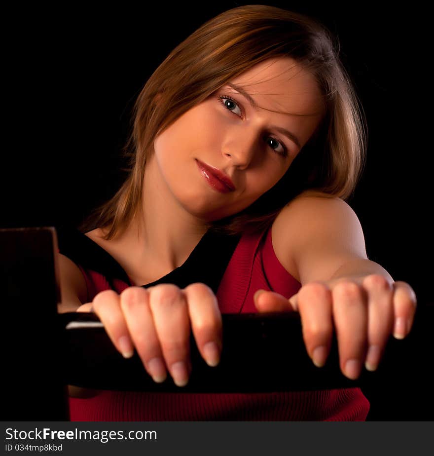 Pretty young girl sitting on chair