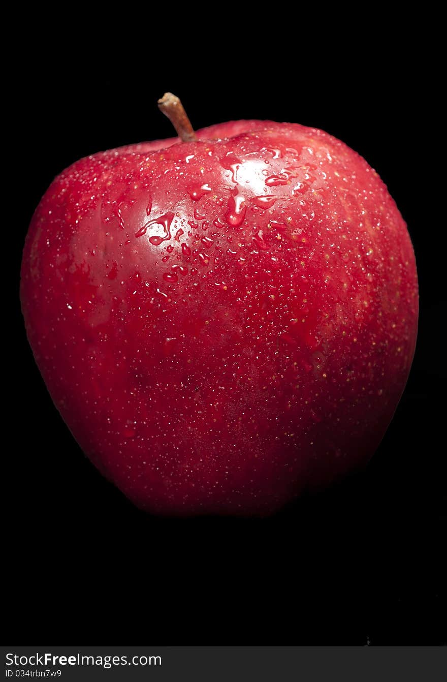 Fresh red apple with black background