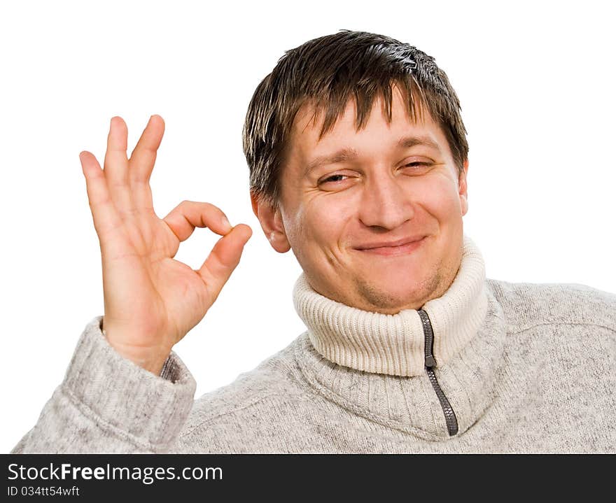 A young man shows a hand gesture (sign) OK. A young man shows a hand gesture (sign) OK.