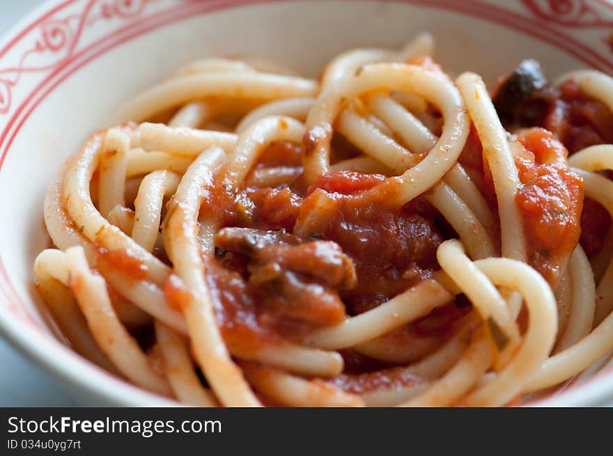 Plate of fettucini with tomato sausse and pepper. Plate of fettucini with tomato sausse and pepper