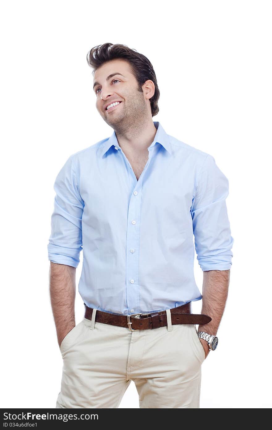 Man in blue shirt and light trousers standing, smiling- isolated on white. Man in blue shirt and light trousers standing, smiling- isolated on white