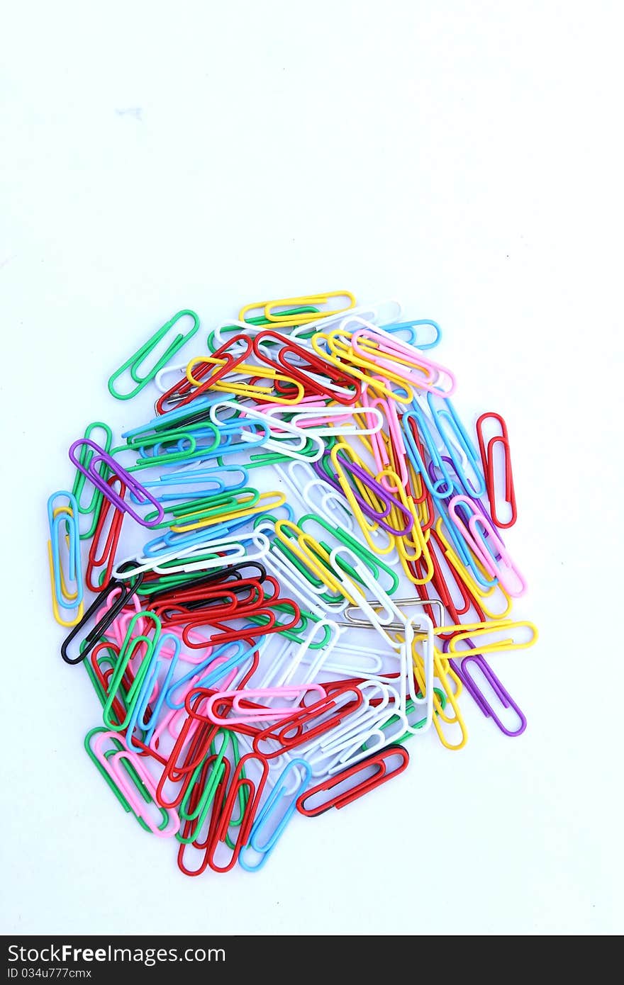 The image of paper clips under the white background. The image of paper clips under the white background