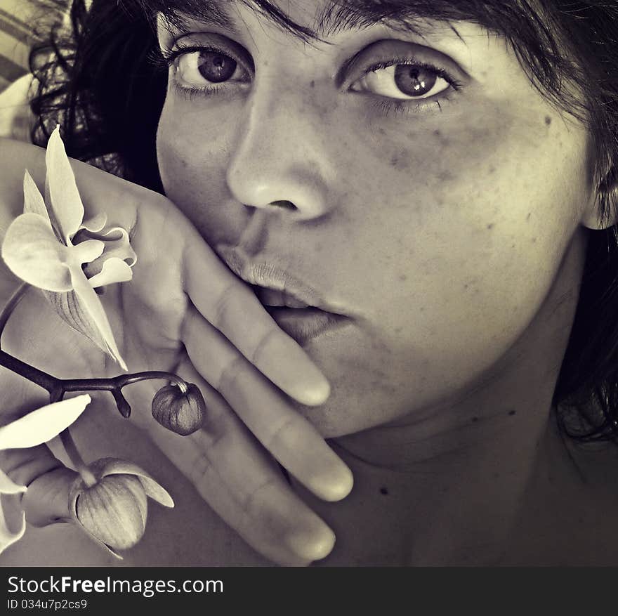 Young woman and orchid - black and white colored photography