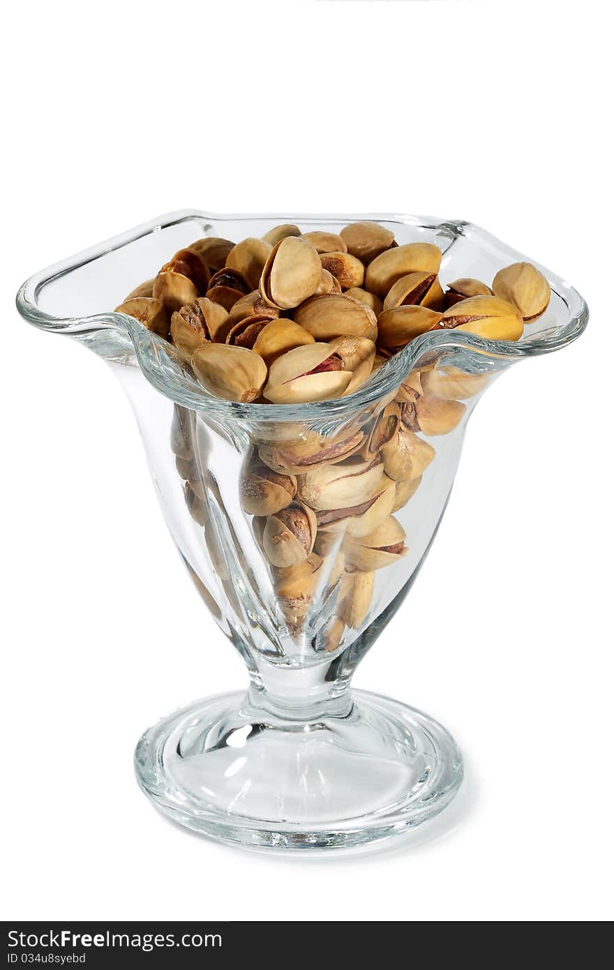 Pistachio nuts and salt in a glass vase