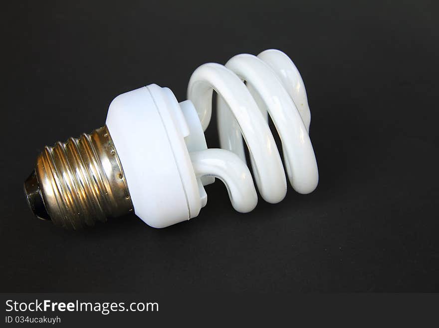 A florescent bulb symbolizing the saving energy of and money. A florescent bulb symbolizing the saving energy of and money