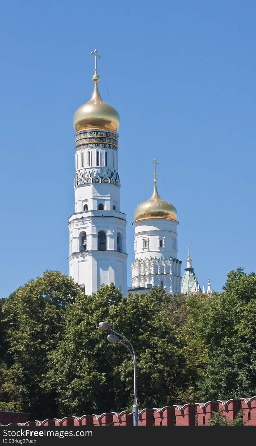 Ivan the Great Bell - part of an ensemble of the Kremlin cathedrals. Kremlin. Moscow. Ivan the Great Bell - part of an ensemble of the Kremlin cathedrals. Kremlin. Moscow