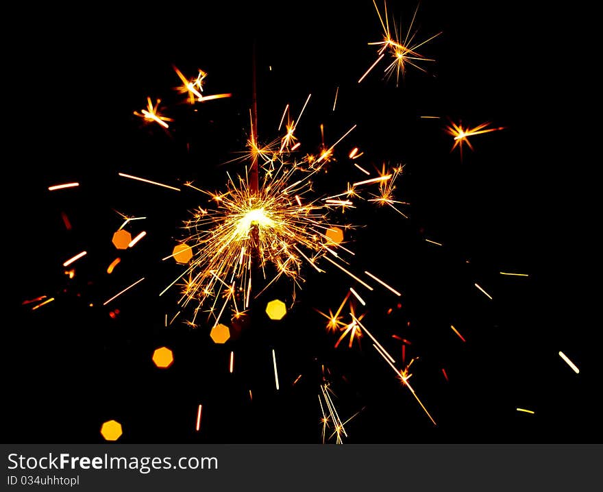 Golden fire works sparkle with black background. Golden fire works sparkle with black background