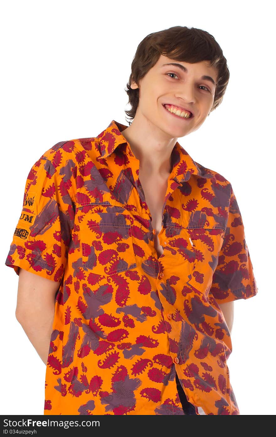 Happy joyful yound man standing in colorful shirt and smiling on whgite background. Happy joyful yound man standing in colorful shirt and smiling on whgite background