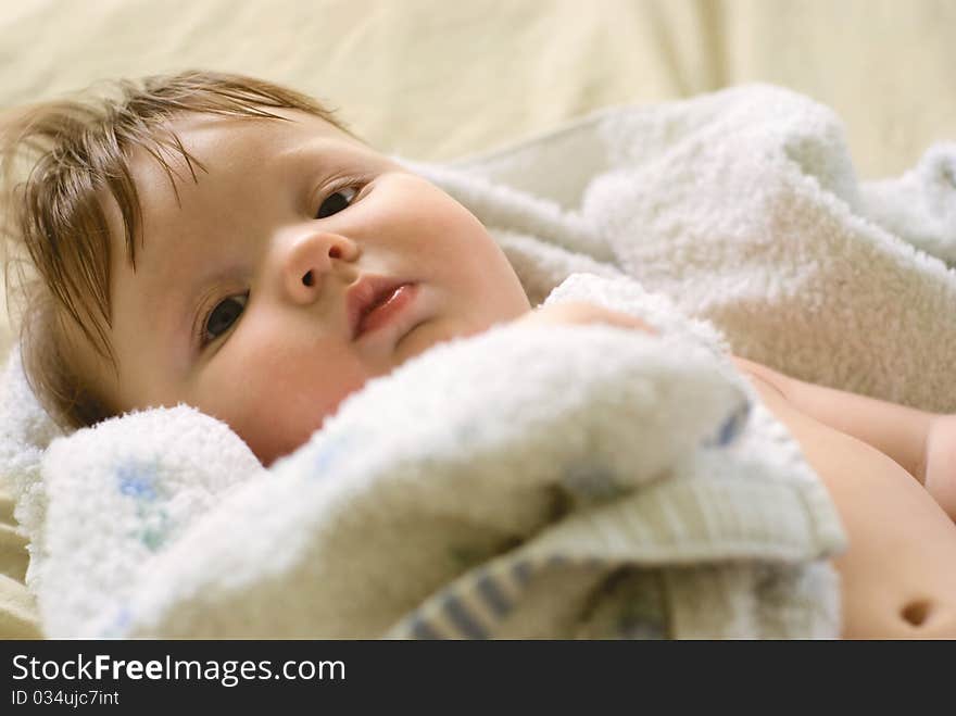 A little boy lying on sofa