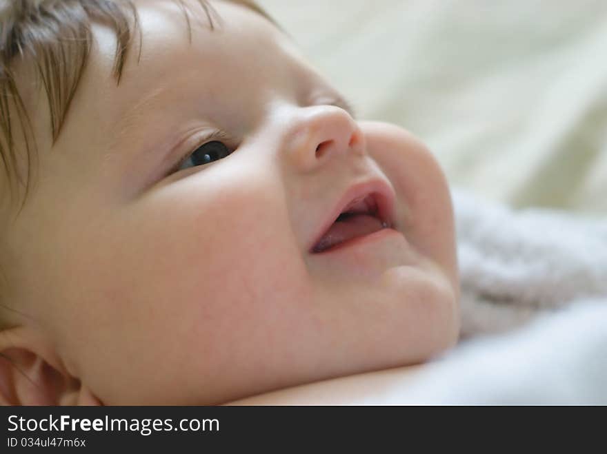 A little boy lying on sofa