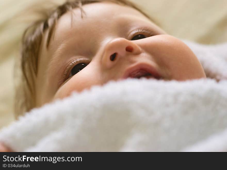 A little boy lying on sofa