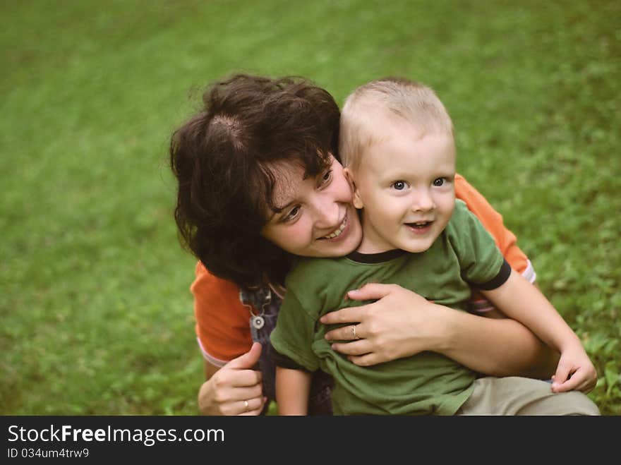 A little boy and his mother in the park