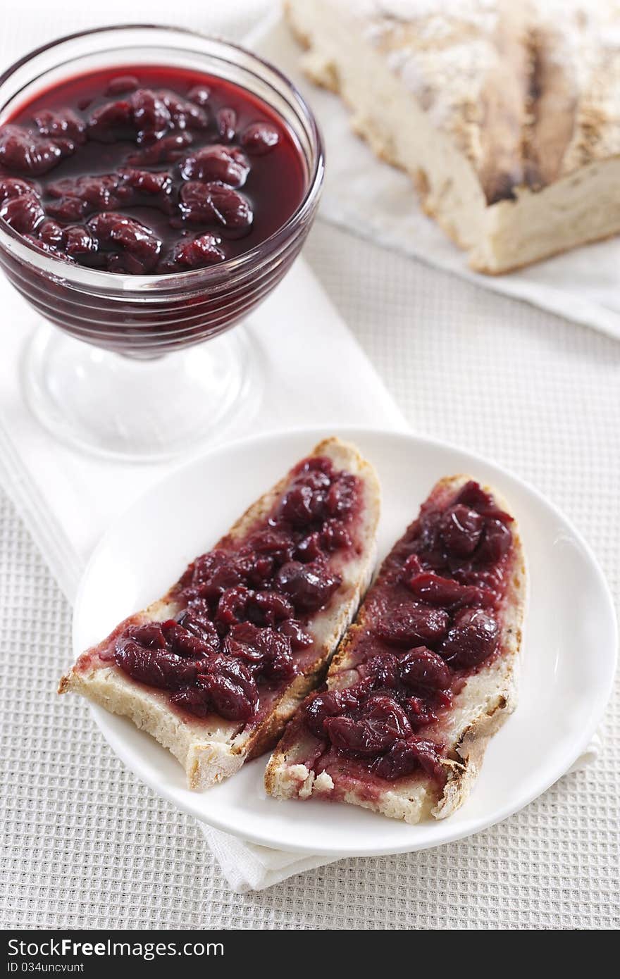 Breakfast of cherry jam on toast