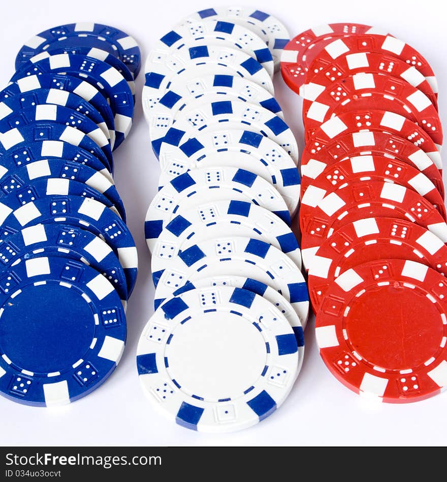 Photography of three line chips colored blue white and red. Photography of three line chips colored blue white and red