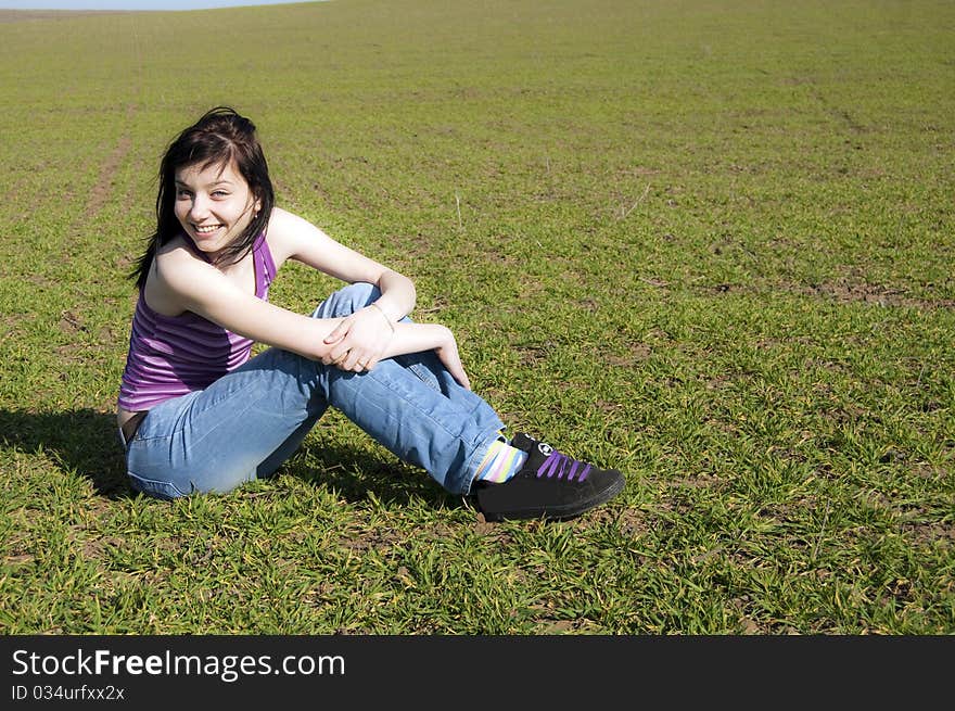 Beautiful Black Hair Girl on green field