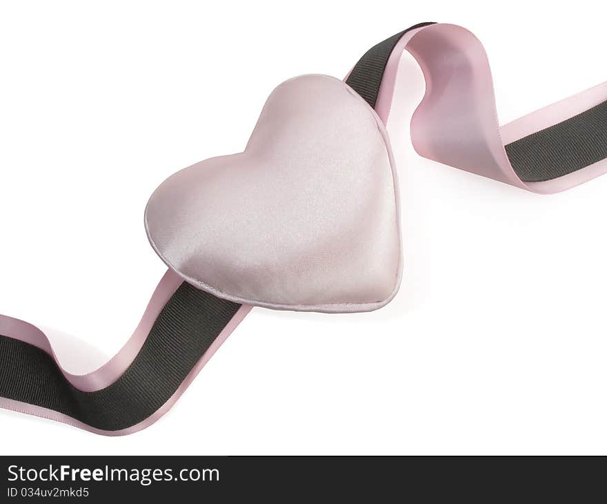 Pretty pink satin heart with pink and brown ribbon on white. Pretty pink satin heart with pink and brown ribbon on white